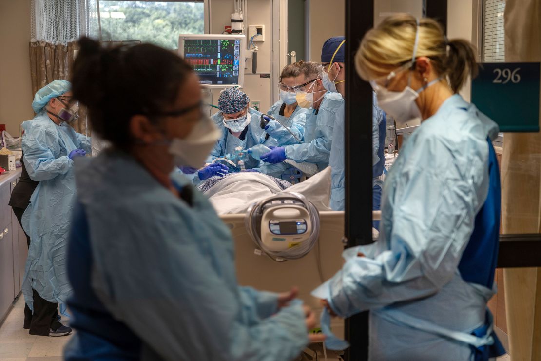 A nurse in a Clearwater, Florida, hospital prepares to help place a positive Covid-19 patient on a respirator. 