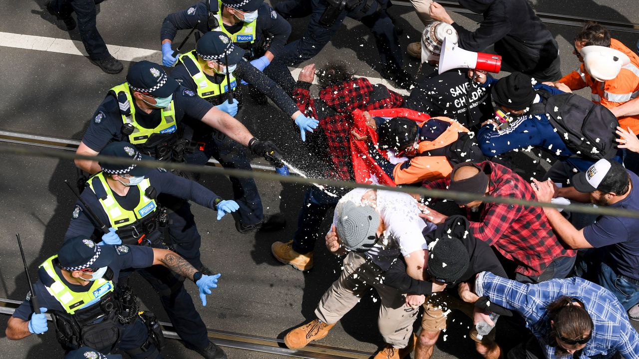 Victoria police fire pepper spray during a clash with protesters at a Rally for Freedom in Melbourne, Australia, on Saturday, Sept. 18, 2021. 