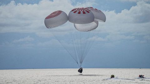 The SpaceX Crew Dragon capsule splashes down into the ocean off the coast of Florida.