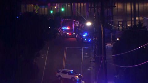 Police cars surround the scene of a shooting that left two people dead in Durham, North Carolina.