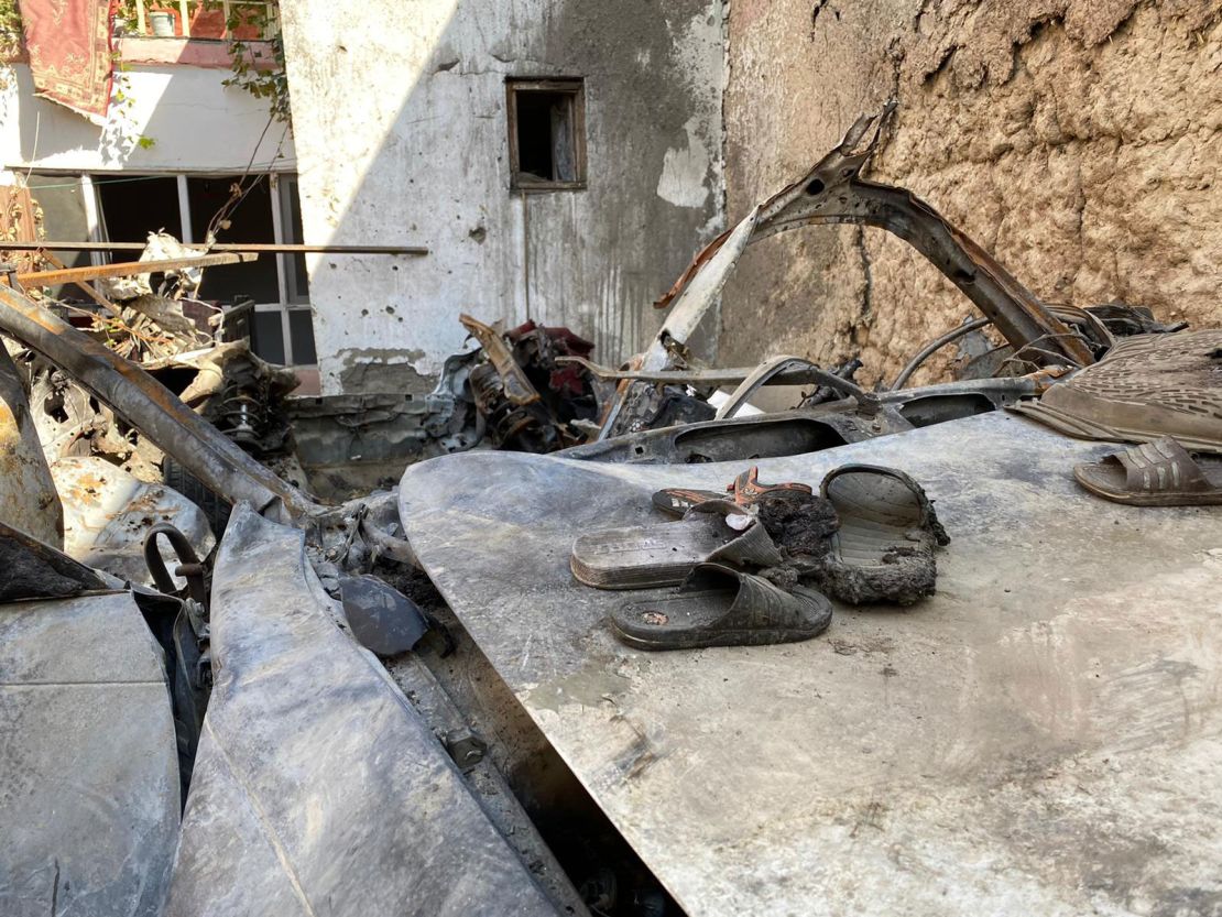 A pair of sandals sit on the car destroyed in a US airstrike in Kabul on August 29 in which 10 civilians were killed.