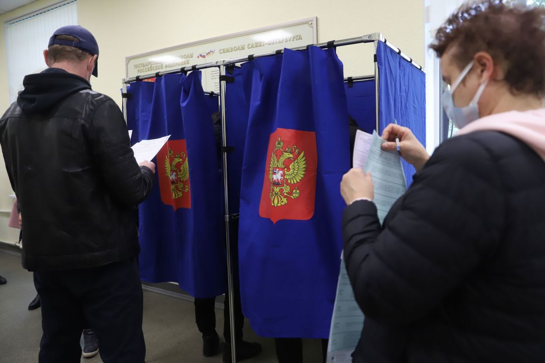 People vote during the last day of the three-day parliamentary and local elections in Russia.