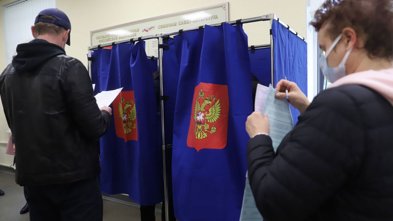 People vote during the last day of the three-day parliamentary and local elections in Russia.