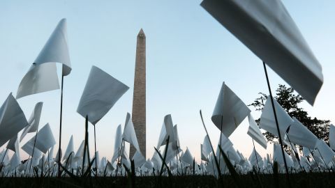 The "In America: Remember" public art installation in Washington, DC, commemorates all Americans who have died from Covid-19. On September 18, more than 660,000 small plastic flags were at the site, some with personal messages to those who died.  
