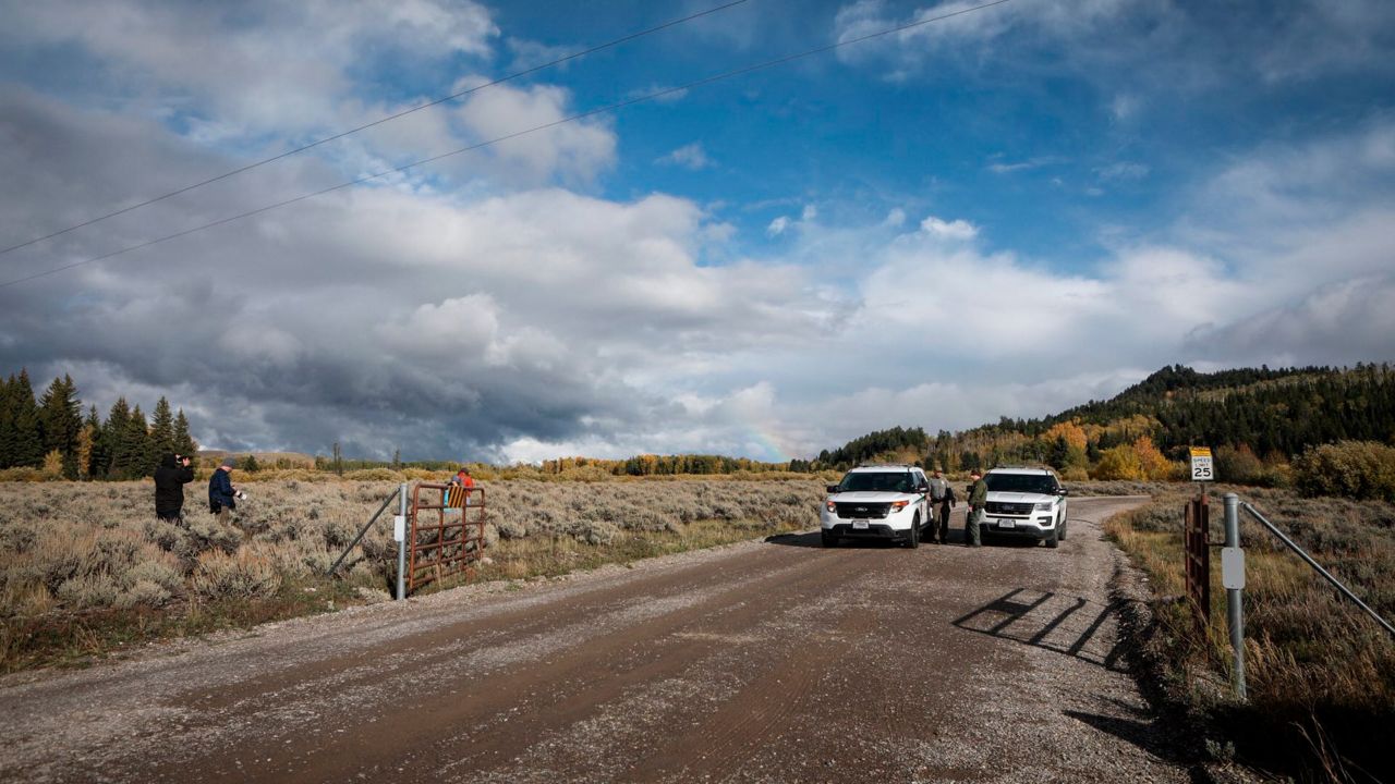 US Park Ranger vehicles block access in the Spread Creek area of the Bridger-Teton National Forest, where human remains believed to be of Gabby Petito were found in Wyoming on Sunday.