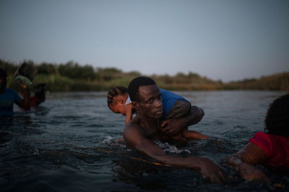 Migrants wade across the Rio Grande on September 19. 