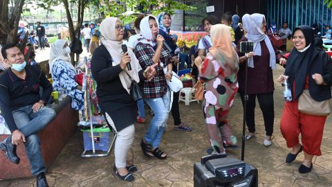 A group of residents gathering for an outdoor karaoke session at a park on the outskirts of Jakarta, Indonesia, on September 19.
