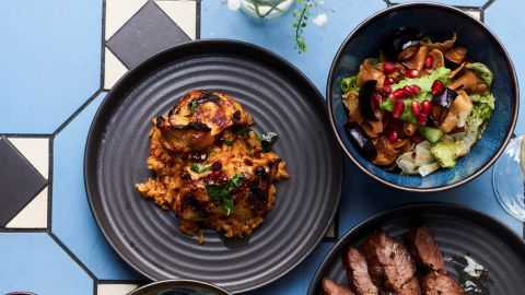 Imad Alarnab serves up Syrian dishes in his London eatery, including Jaj Barghol (chicken thigh with bulgur wheat) and Fattoush Baitinjan (aubergine, cucumber and avocado), pictured here.