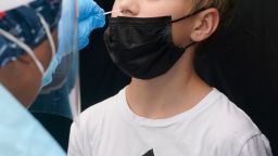 FILE- Jonathan Pagliarulo, 11, gets tested for COVID-19, after vaccinated family members tested positive for the virus, Monday, Aug. 9, 2021, in North Miami, Fla. Several Florida pediatric hospitals are reporting an increase in COVID-19 cases as schools reopen and the delta variant surges. (AP Photo/Marta Lavandier, File)