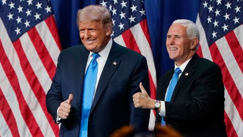 Then-President Donald Trump and then-Vice President Mike Pence give a thumbs up after speaking on the first day of the Republican National Convention on August 24, 2020, in Charlotte, North Carolina. 