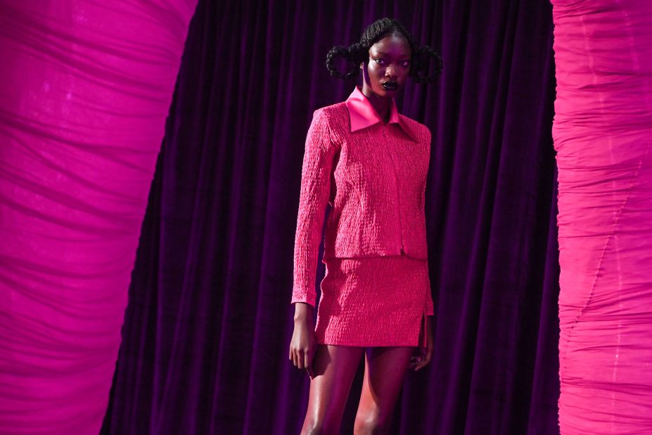 Extroverted evening wear made up Feben's debut presentation, with barely-there satin twist tops and hot pink skirt suits.