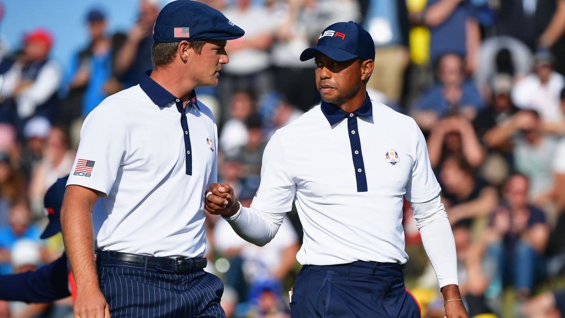 Woods and Bryson DeChambeau celebrate during the afternoon foursome matches of the 2018 Ryder Cup.