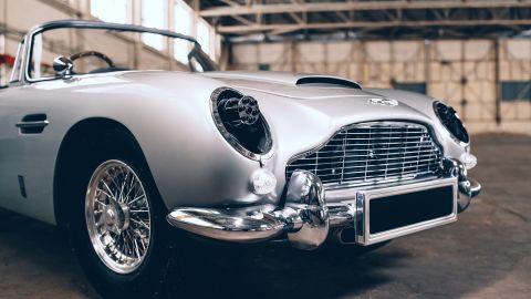 The Little Car Company's James Bond Aston Martin DB5 has toy machine guns that can come out through the headlights openings.