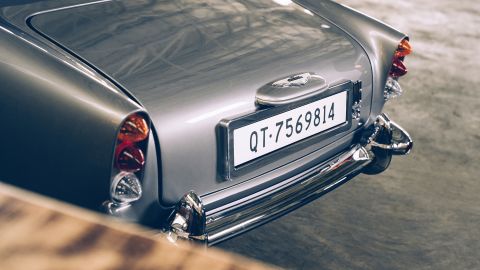 The miniature James Bond DB5 includes a changeable digital license plate and an exhaust pipe smokescreen feature.
