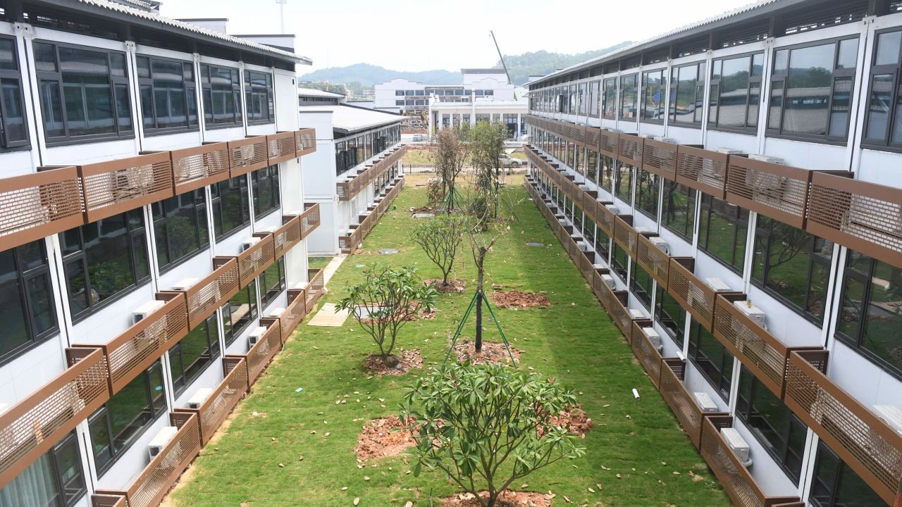 Comprised of rows of three-story buildings, the Guangzhou quarantine facility for foreign arrivals has 5,000 rooms.
