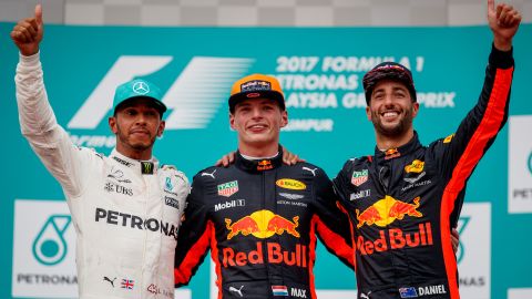 Max Verstappen, Lewis Hamilton and Daniel Ricciardo celebrate on the podium following the Malaysia Grand Prix in 2017.