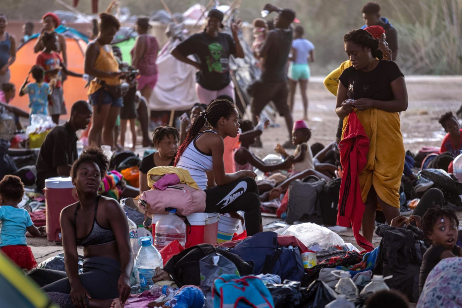 Migrants camp under the Del Rio International Bridge on Tuesday, September 21.
