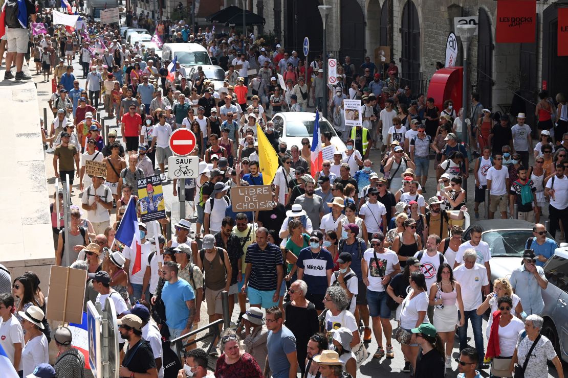Demonstrators march in Marseille, southern France, during a national day of protest against the health pass mandated by the government in August.