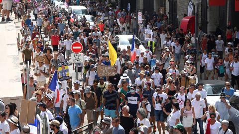 Demonstrators march in Marseille, southern France, during a national day of protest against the health pass mandated by the government in August.