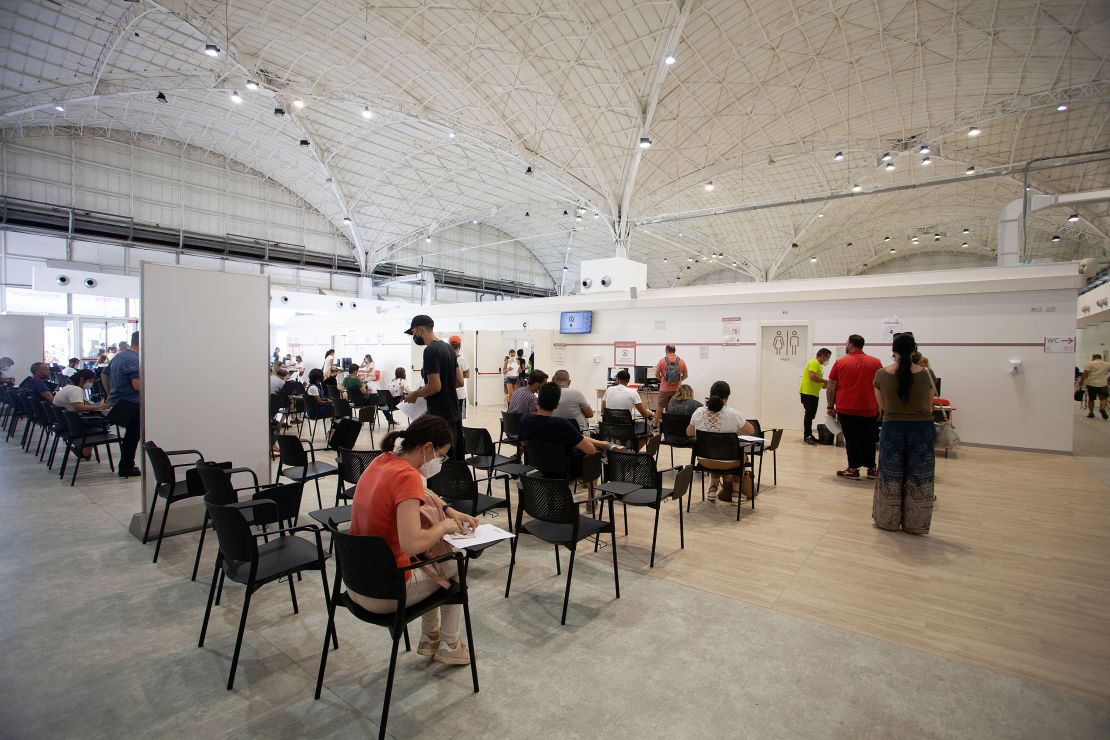 People wait in a vaccination center on August 7 in Bari, southern Italy. 