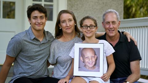 Nancy Goodman (second from left), with Ben (left), Sarah, husband Michael and a photo of Jacob.