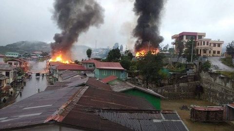 A handout photo made available by The Chinland Post shows burning houses due to military shelling with heavy artillery in Thantlang town, Chin State, Myanmar, on September 18. 