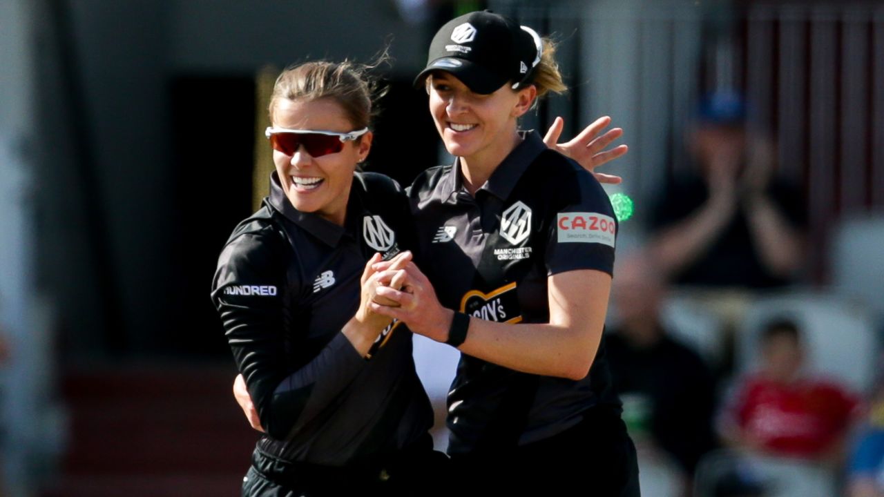Alex Hartley (left) and Kate Cross celebrate a wicket while playing for the Manchester Originals on August 10.