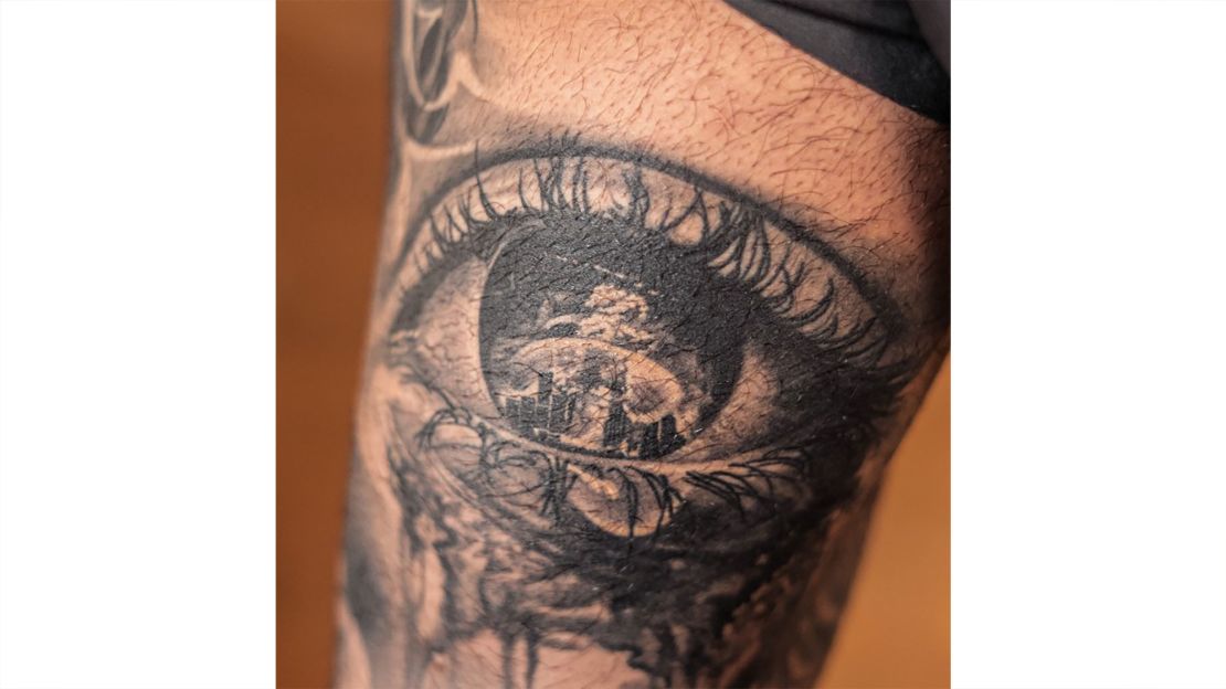 A tattoo depicts the explosion with tears forming the outline of Lebanon.