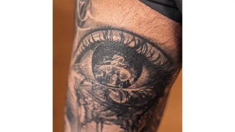 A tattoo depicts the explosion with tears forming the outline of Lebanon. 