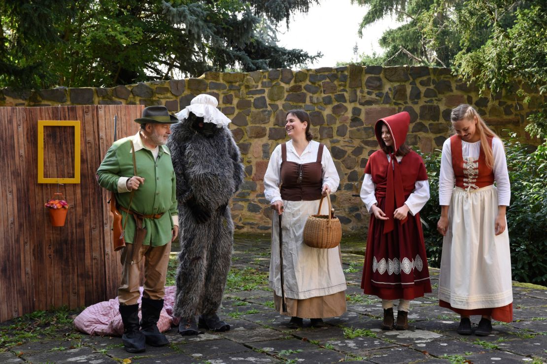 Characters perform "Little Red Riding Hood" at the monestary garden.