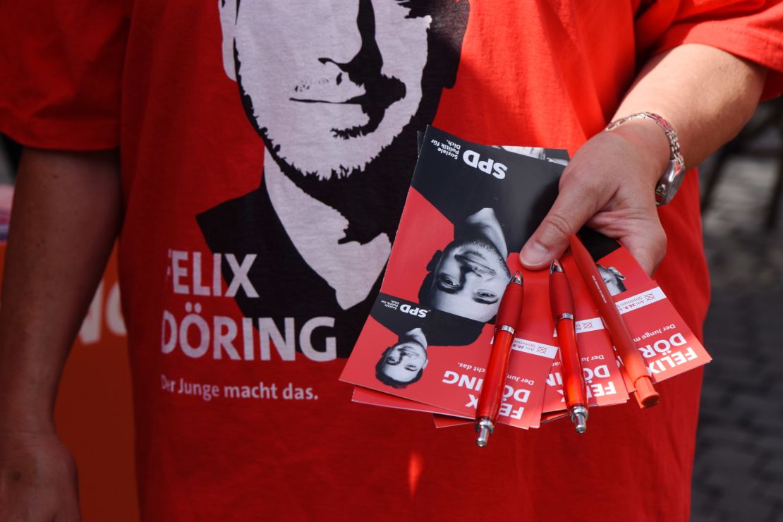 Pamphlets are given out by the Social Democrats (SPD) at the main square in Alsfeld.