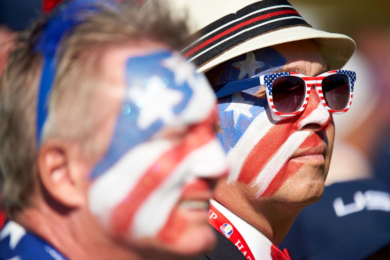 Team USA fans with faces painted in red, white, blue, stars and stripes at Hazeltine National in 2016.
