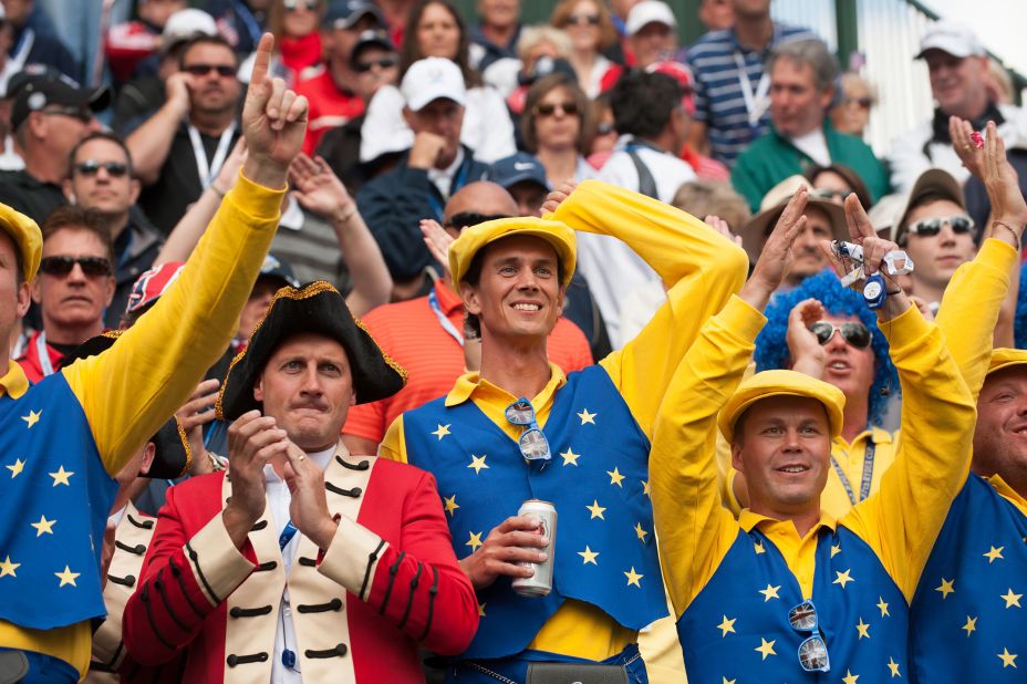 European team fans cheer at the first hole during the morning foursome matches for the 39th Ryder Cup in Illinois.