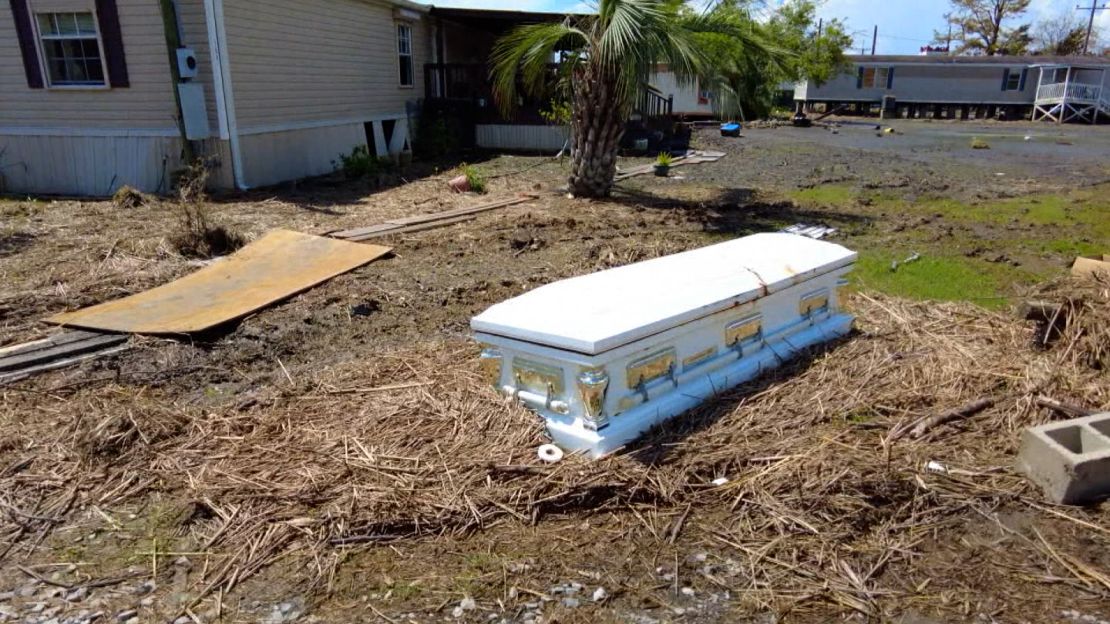 A casket sits near a home in Ironton, Louisiana.
