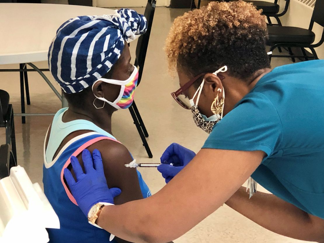 A woman gets her first Covid-19 vaccine at a Cuthbert, Georgia, clinic aimed at teens