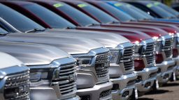 A lone line of unsold 2021 pickup trucks in an empty storage lot at a Dodge Ram dealership Sunday, Sept. 12, 2021, in Littleton, Colo. (AP Photo/David Zalubowski)
