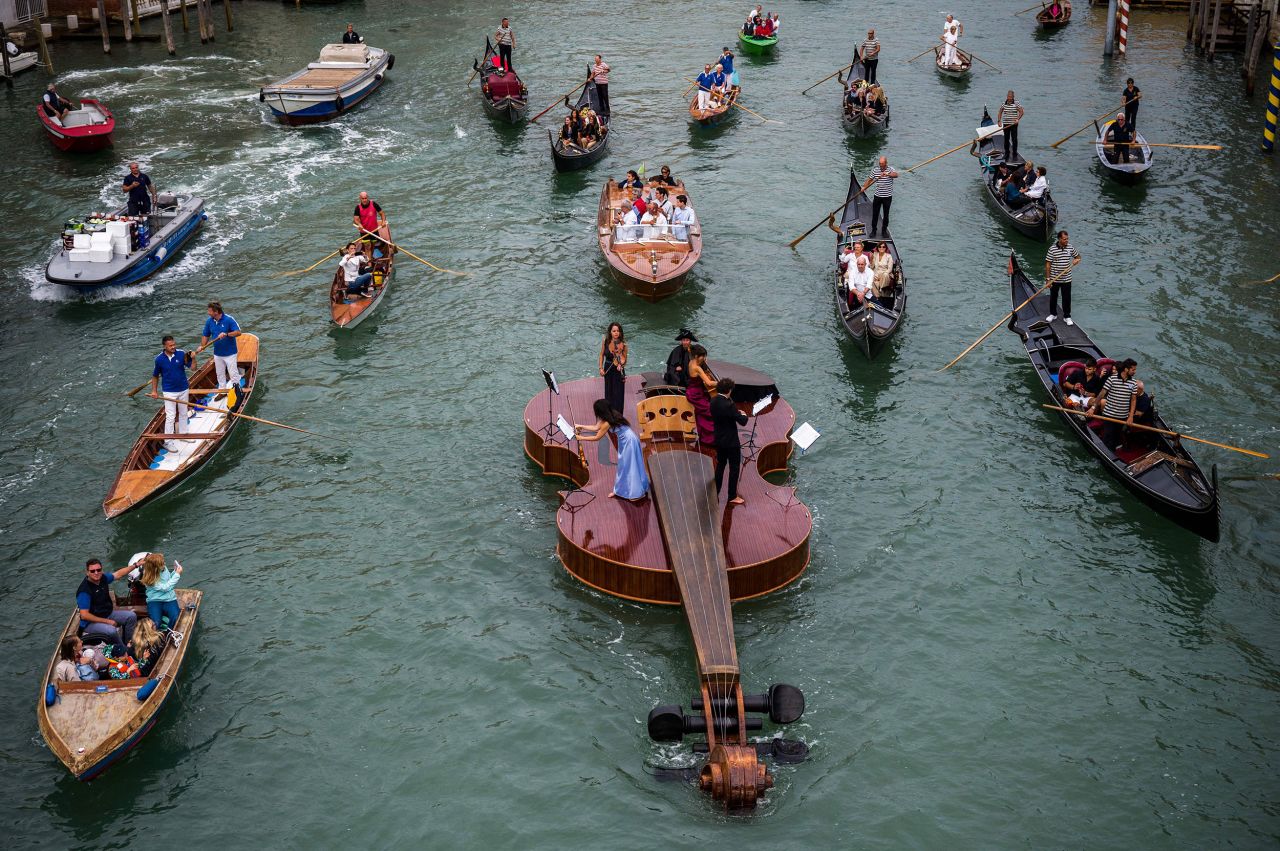 "Noah's Violin," by sculptor Livio De Marchi, floats during a concert on the Grand Canal in Venice, Italy, on Saturday, September 18. The approximately 39 foot (12 meter) long craft is a tribute to Covid-19 victims, according to the City of Venice. <a href="https://www.cnn.com/travel/videos/travel/2021/09/20/violin-boat-venice-lon-orig-tp.cnn" target="_blank">A string quartet performed Vivaldi</a> as it made it's way along the canal.