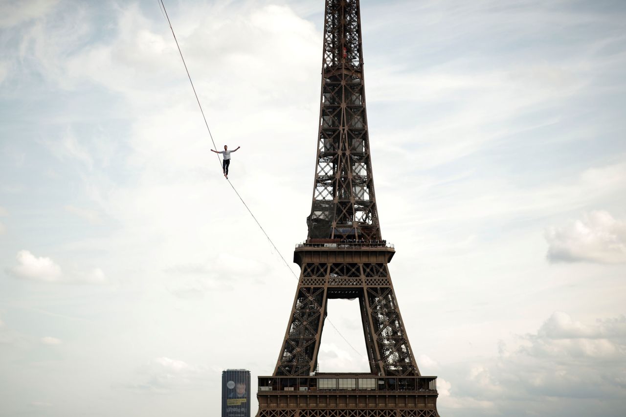 Nathan Paulin walks on a slackline between the Eiffel Tower and the Théâtre National de Chaillot during events for Heritage Day in Paris on Saturday, September 18. <a href="https://www.cnn.com/2021/09/19/europe/france-paris-slackline-eiffel-tower-seine-walk-scli-intl/index.html" target="_blank">Paulin walked the 600-meter slackline</a> in a trip that took the 27-year-old just half an hour.