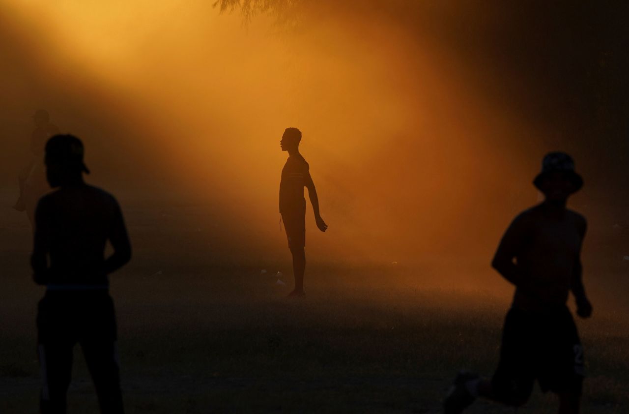 Migrants play soccer at a makeshift refugee camp in Ciudad Acuña, Mexico, on Wednesday, September 22.