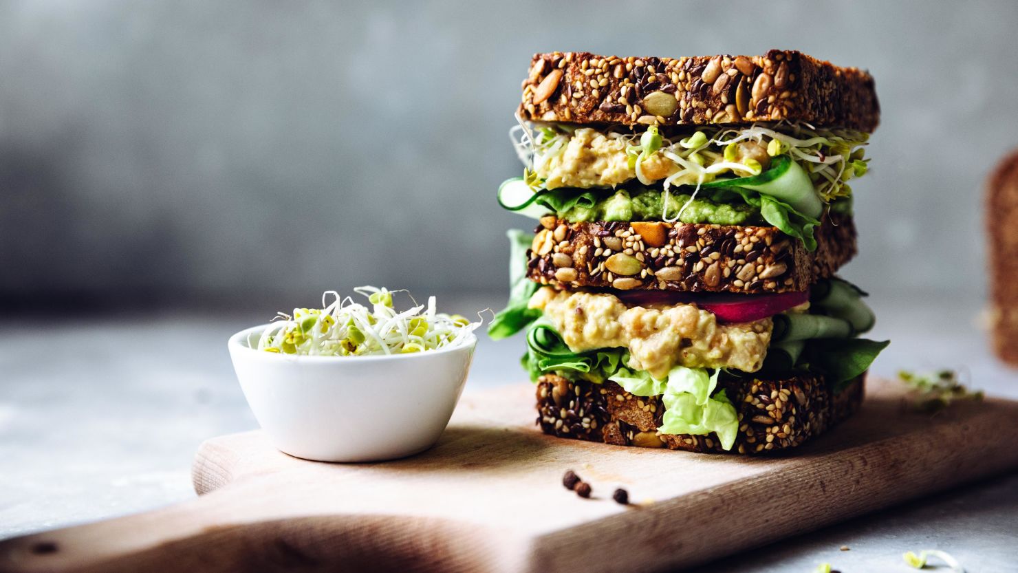 Give your kid's school lunch an upgrade with this cucumber, radish and smashed avocado  sandwich on sourdough.