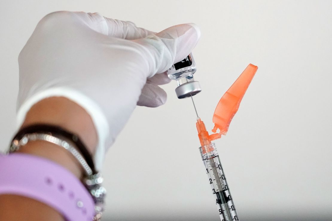 Tameiki Lee, a nurse with the Jackson-Hinds Comprehensive Health Center, loads a syringe with the Pfizer/BioNTech vaccine at a facility near Jackson State University in Mississippi on Tuesday. Vaccinations for community residents, faculty, staff and students were provided free of charge. 