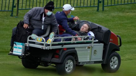 Felton is carted off the course.
