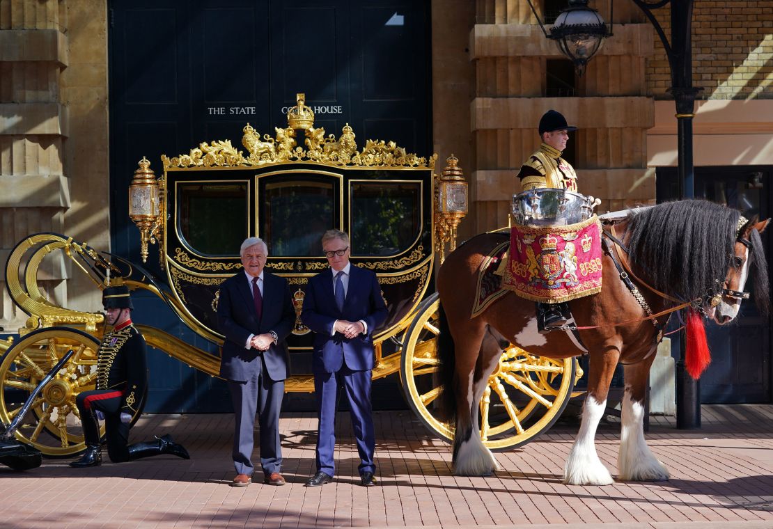 Simon Brooks-Ward, producer and director (right), and Mike Rake, chairman of the Platinum Jubilee's advisory committee, pose in front of the Diamond Jubilee State Coach during the media launch for the Queen's Platinum Jubilee celebration.