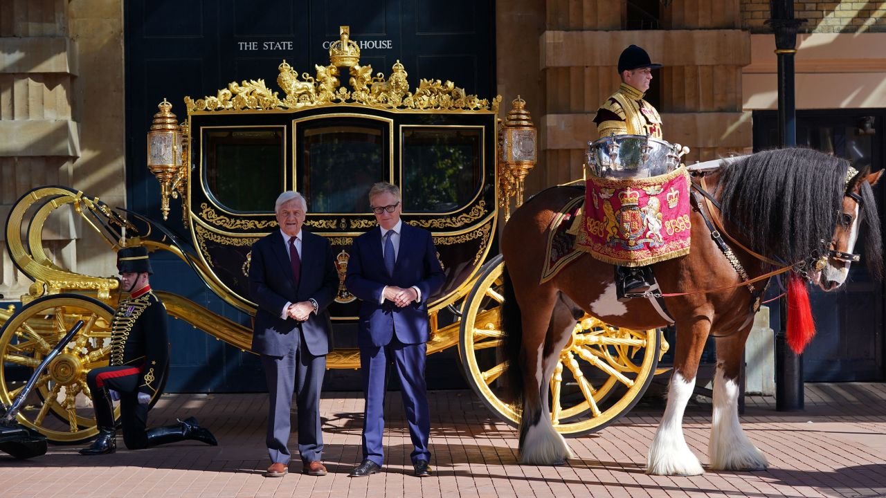 Simon Brooks-Ward, producer and director (right), and Mike Rake, chairman of the Platinum Jubilee's advisory committee, pose in front of the Diamond Jubilee State Coach during the media launch for the Queen's Platinum Jubilee celebration.