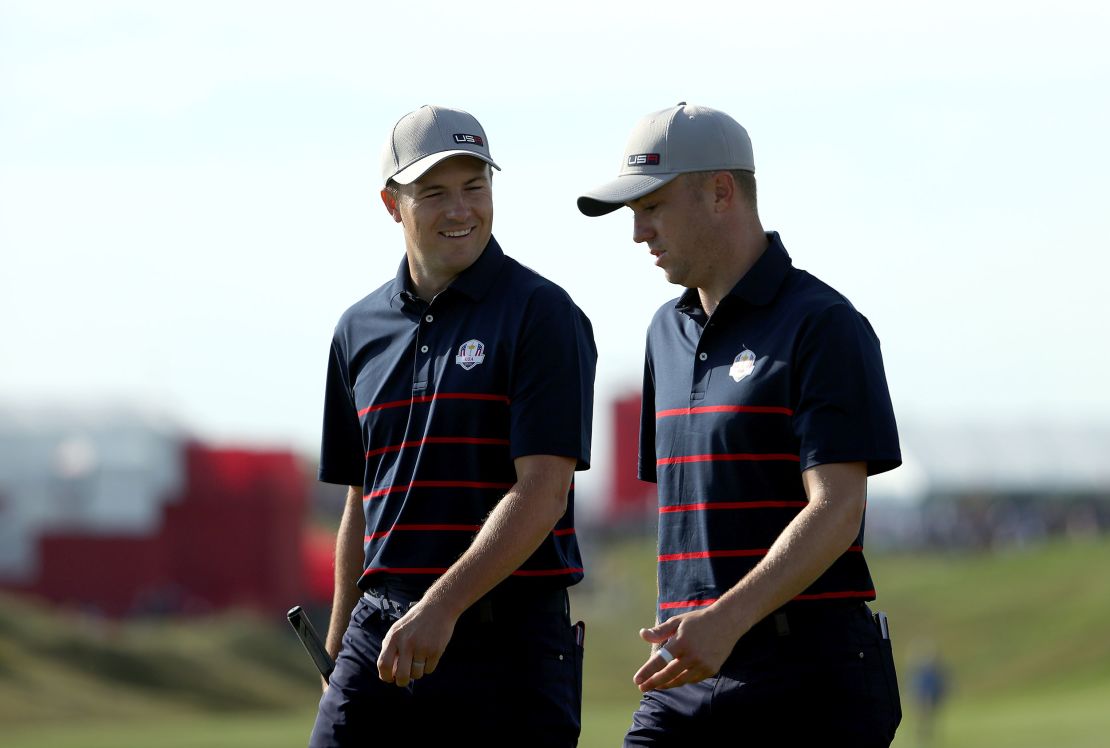 Spieth and Thomas walk during Friday Morning Foursome Matches of the 43rd Ryder Cup.