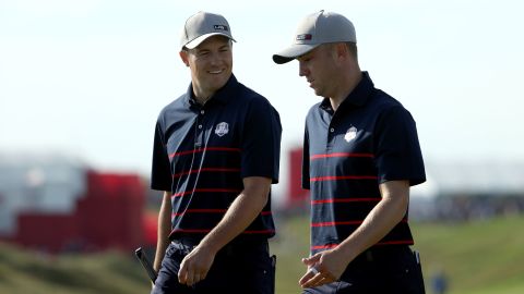 Spieth and Thomas walk during Friday Morning Foursome Matches of the 43rd Ryder Cup.