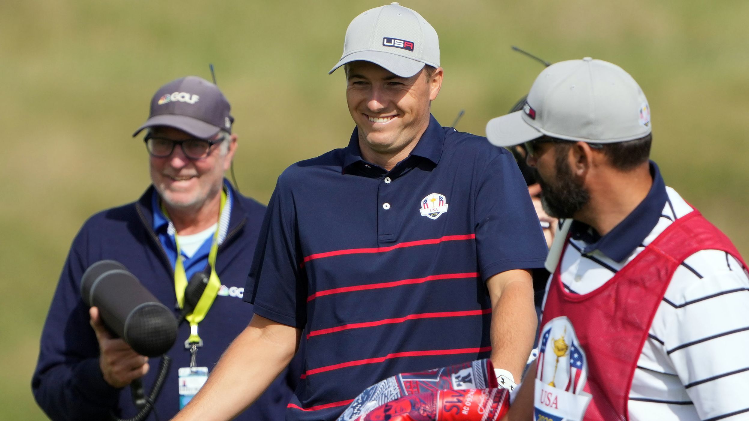 Jordan Spieth reacts to seeing his shot after walking back up onto the 17th green following his shot from the edge slope.