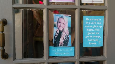 A photo of Mallory Beach is seen in the door of a clothing boutique where she used to work in Beaufort, South Carolina.