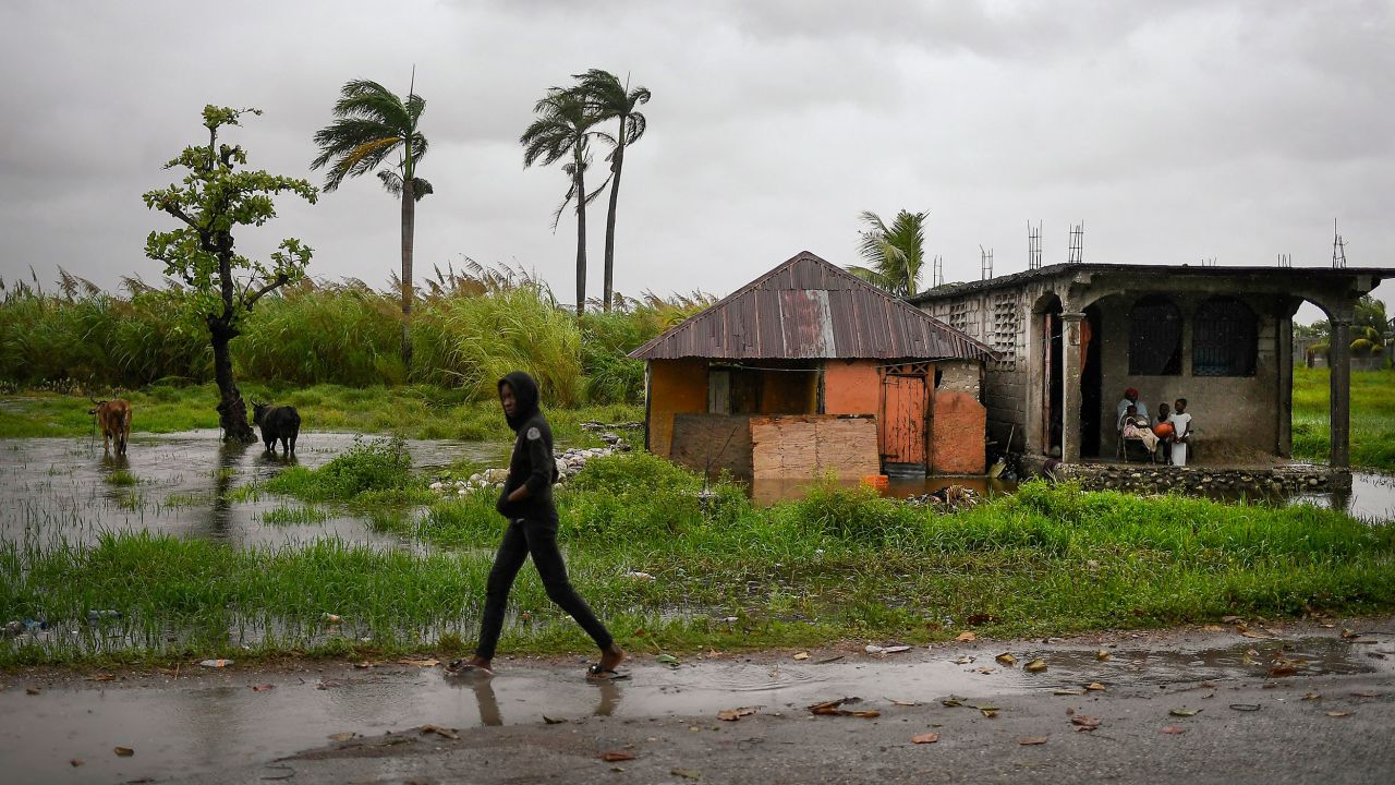 A man walks in an area that was flooded by Tropical Storm Grace, in Trou Mahot, Haiti, on August 17. The storm struck just days after a 7.2-magnitude earthquake.