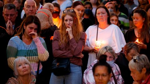 People gather during a vigil for Sabina Nessa in Kidbrooke in London.